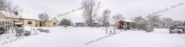 Snow in garden panorama